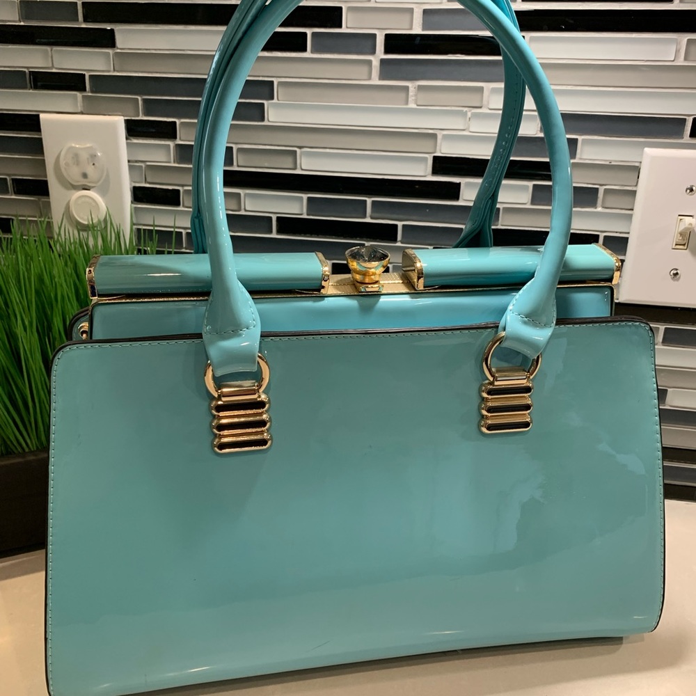 Unique turquoise handbag with many compartments